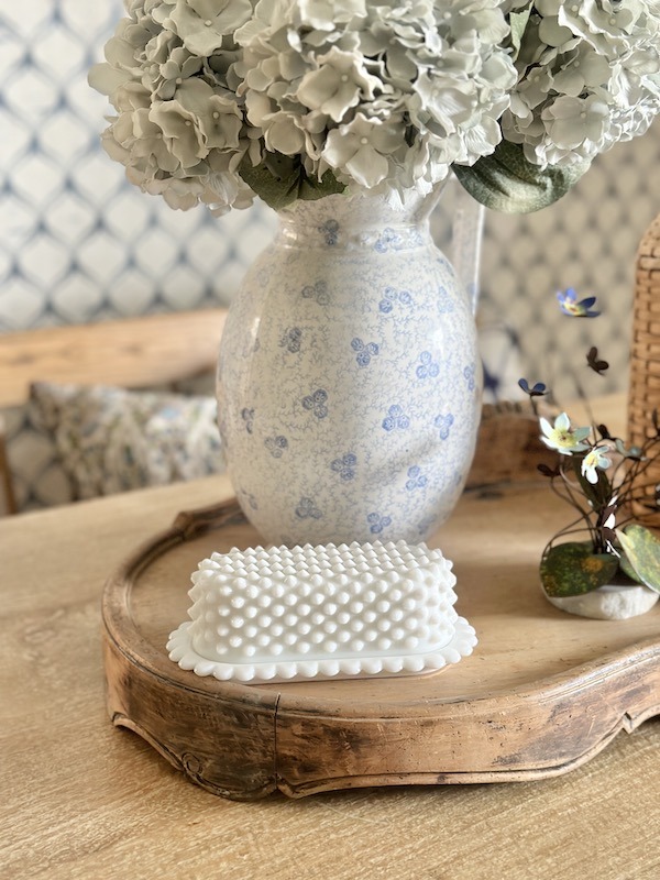milk glass butter dish on display
