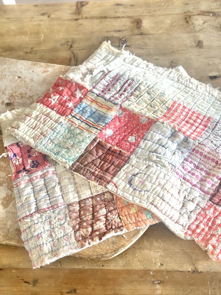 tattered vintage quilt pieces cut for crafts