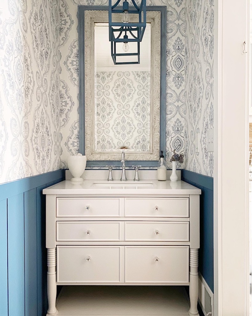 wallpaper and paneling in a half bath