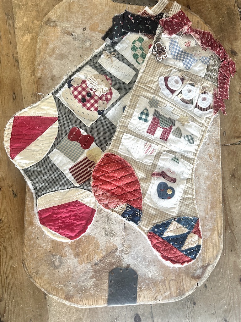 Christmas stockings made with worn quilt pieces