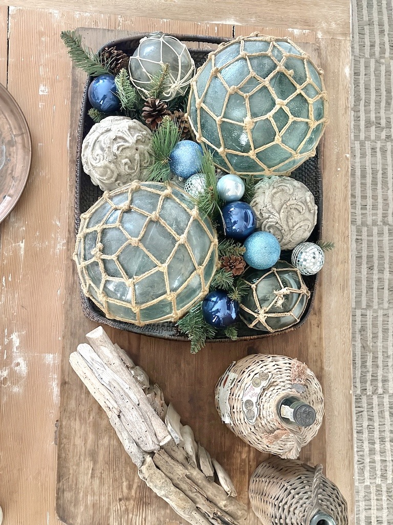 blue and glass ornaments greenery natural elements vintage Christmas decorating bread boards demijohns