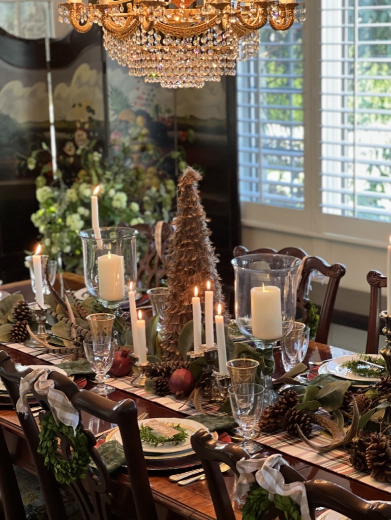 christmas table settings with festive trees and wreaths