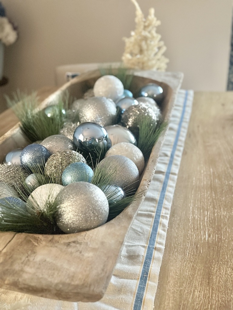 blue and white and silver Christmas ornaments in dough bowl