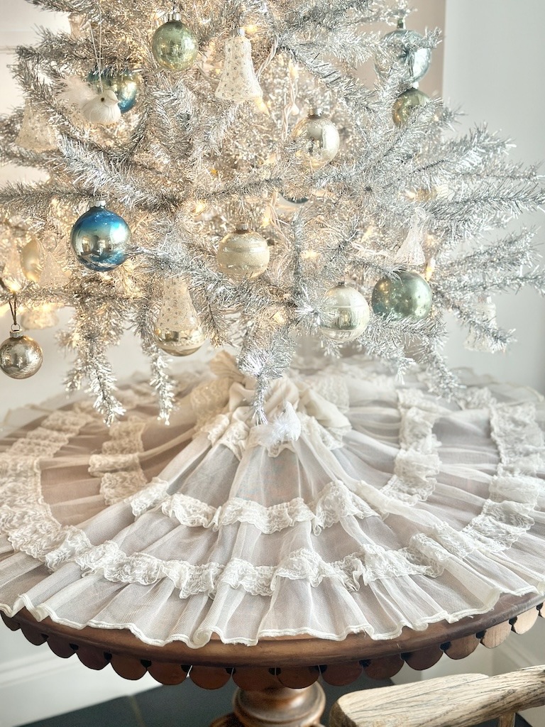 vintage slip used as tree skirt with blue and white ornaments