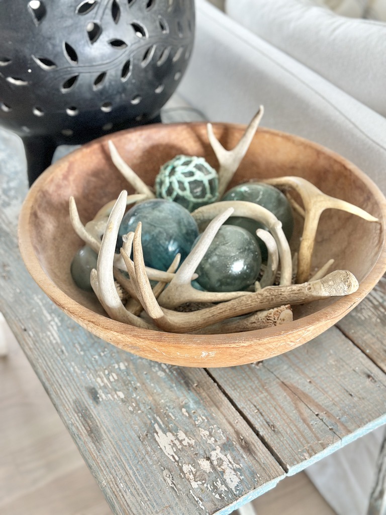 display in a wood bowl found treasures