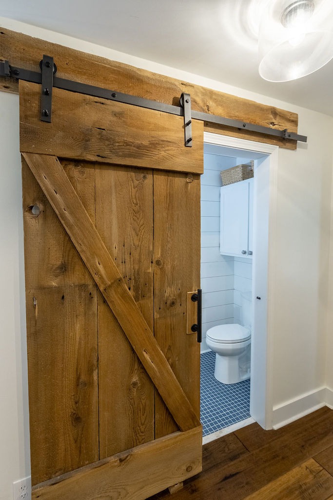 Best Half Bathroom Ideas That are Budget Friendly sliding farmhouse door
