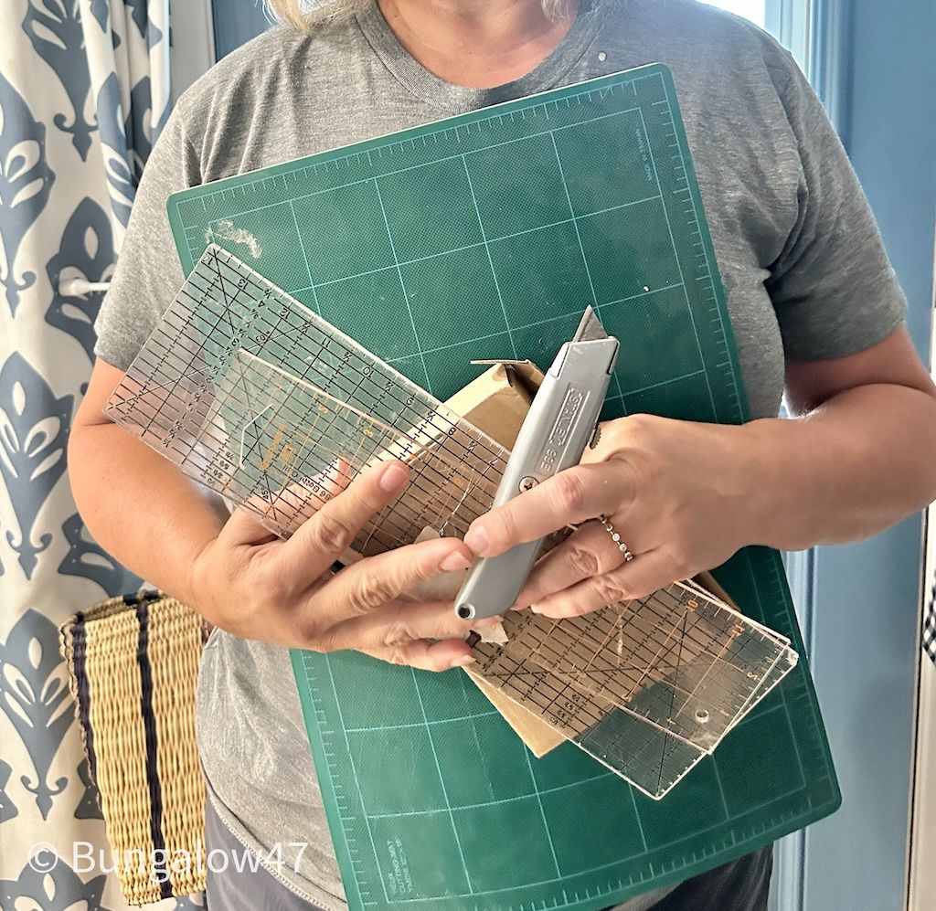 a person with gathered supplies for a DIY project