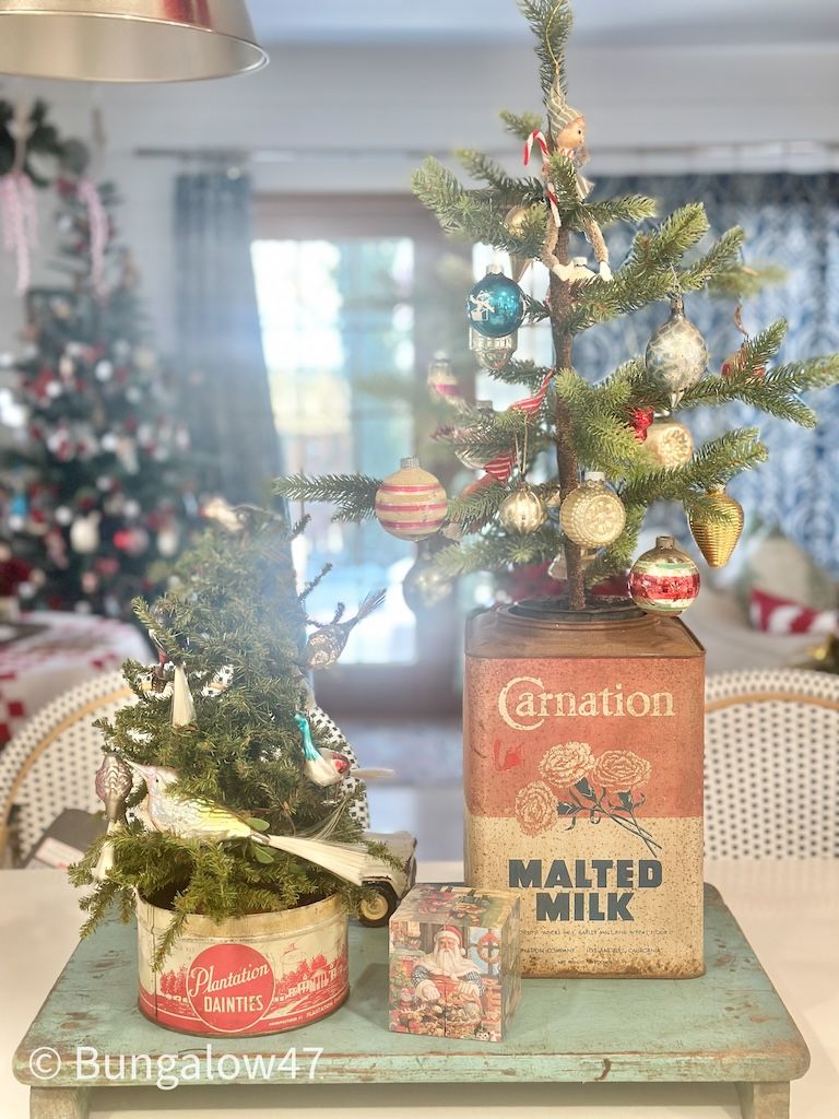 vintage malted milk tin with a Christmas tree inside