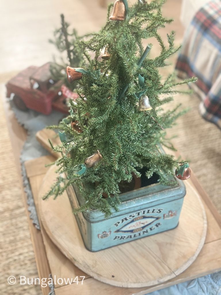 Swedish blue metal cookie tin with a Christmas tree inside
